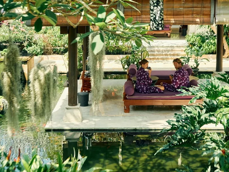 Private Spa Ritual Cliffside Resort Bali — Balinese healing ceremony in a clifftop treatment pavilion at sunset