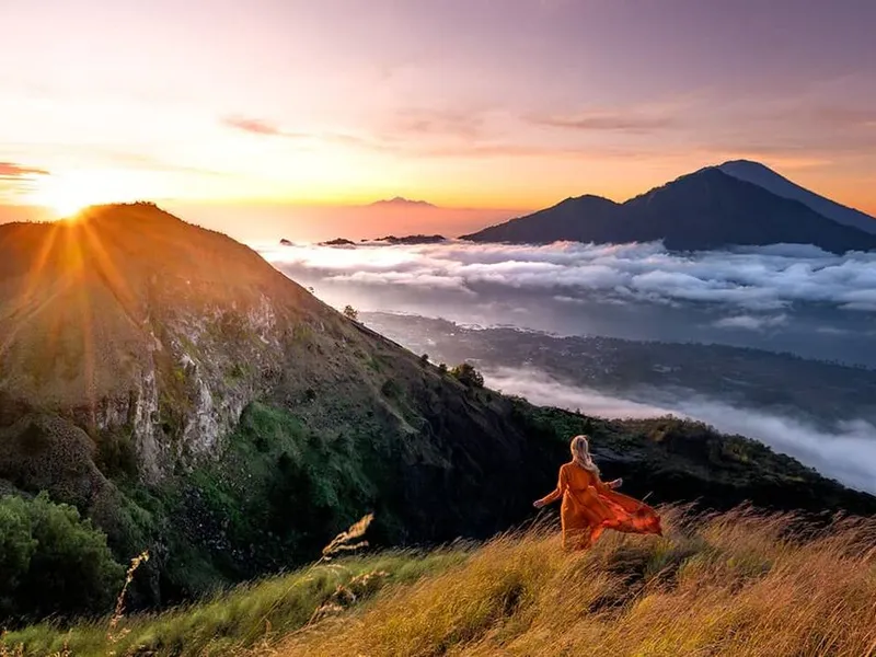 Sunrise Trekking Mount Batur Bali — panoramic volcanic sunrise above the clouds with private guide