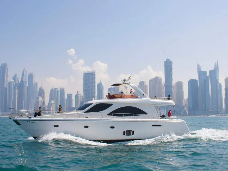 Private Yacht Cruise Dubai Marina — superyacht at sunset past Burj Al Arab and Palm Jumeirah
