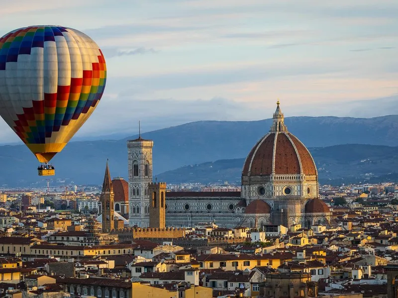 Hot Air Balloon Ride over Tuscany — private sunrise flight above Val d'Orcia UNESCO rolling hills and vineyards