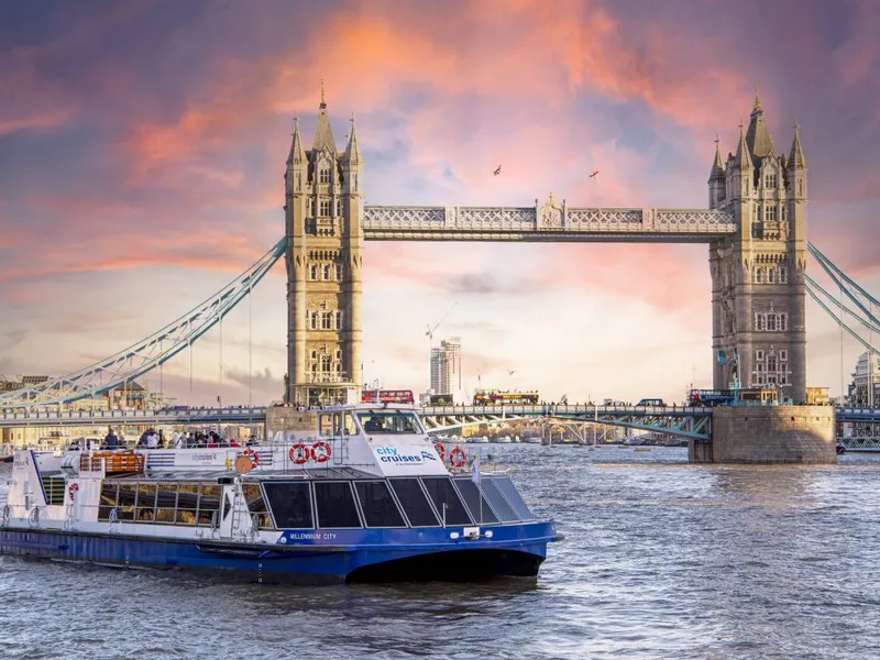 Private Thames River Cruise — luxury boat at night with Tower Bridge lit up in London