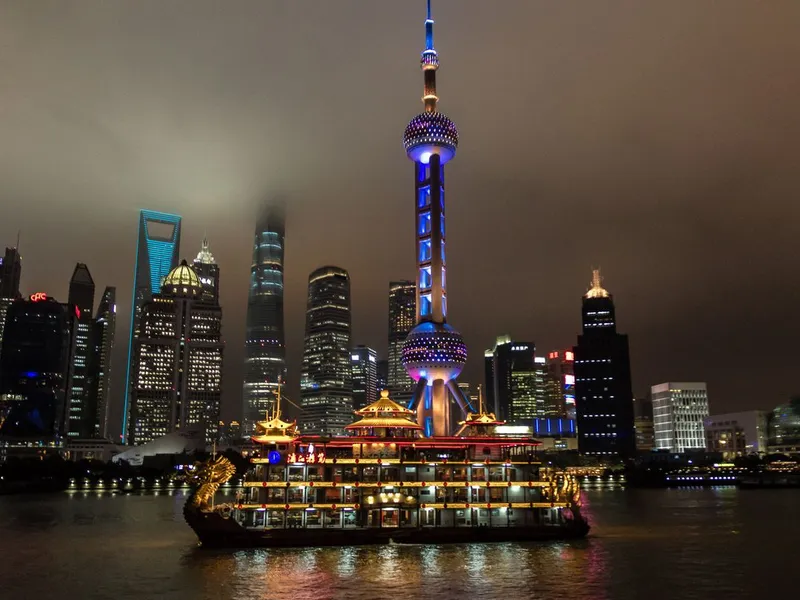 Private Yacht Cruise on the Huangpu River — luxury yacht at dusk with Pudong skyline Shanghai